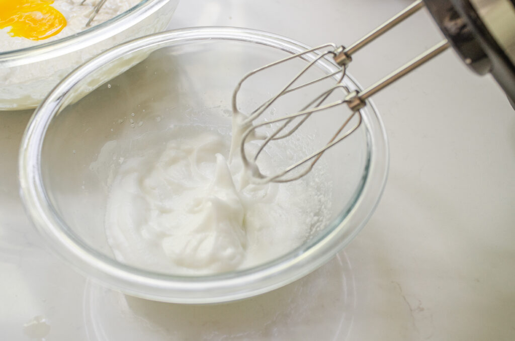 Beating the egg whites separately to fold into the sourdough discard waffle batter.