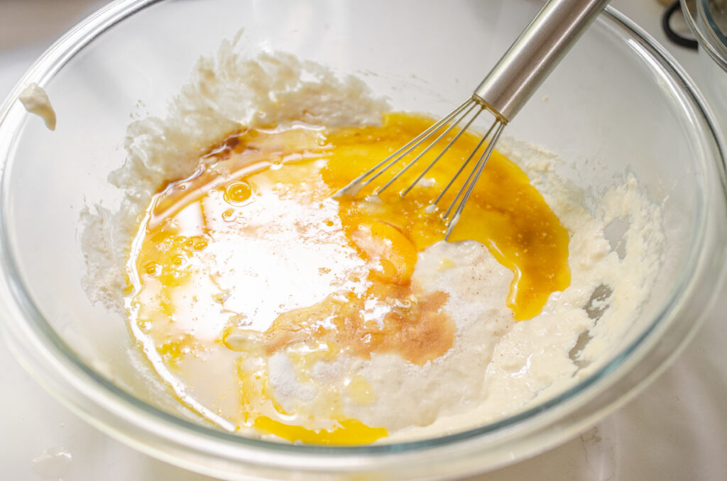 Mixing together the sourdough waffle batter.