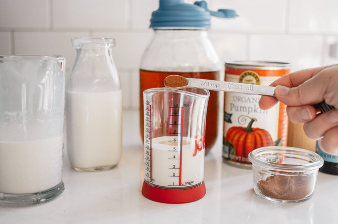 All of the ingredients needed to make pumpkin cold foam at home.