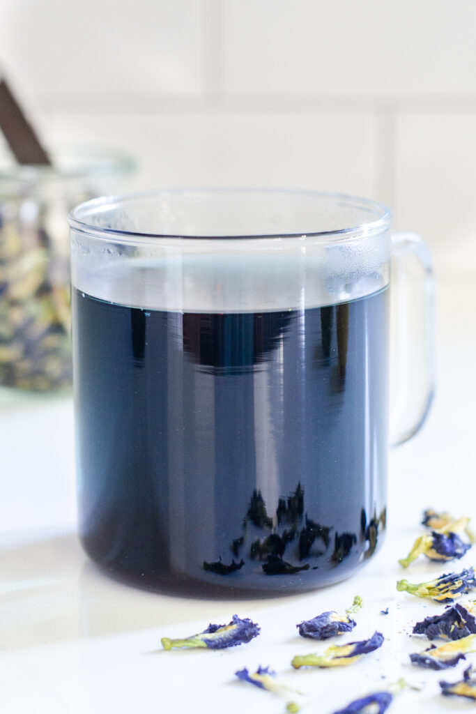 A mug of hot butterfly pea tea.