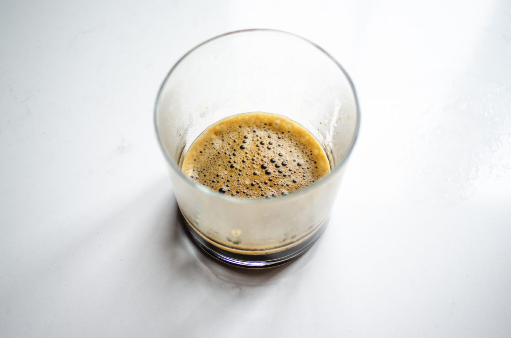 A cup of strongly brewed Aeropress coffee.