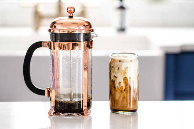 All the ingredients and equipment needed to make cold brew in a French press.