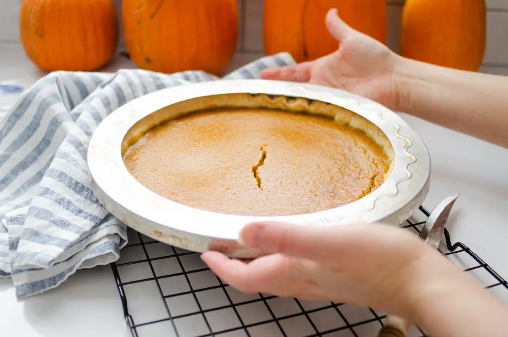 Removing a pumpkin pin to a cooling rack to cool to room temperature before chilling.