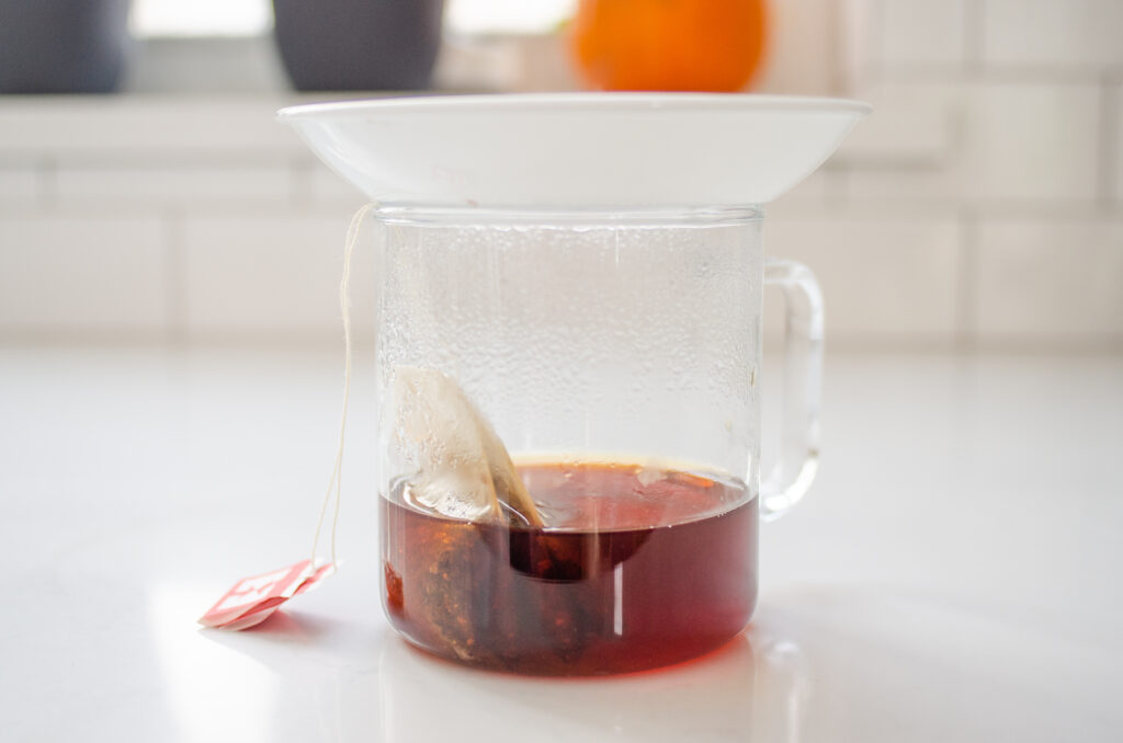 Steeping the chai tea with a plate on top.