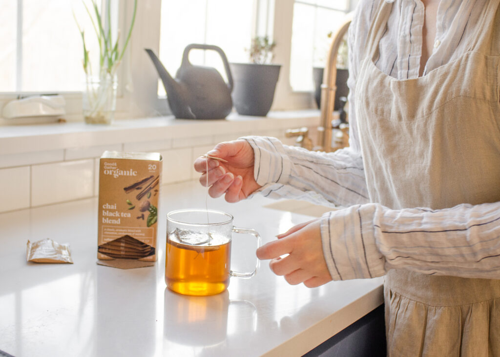 Brewing a cup of chai tea with a tea bag. 