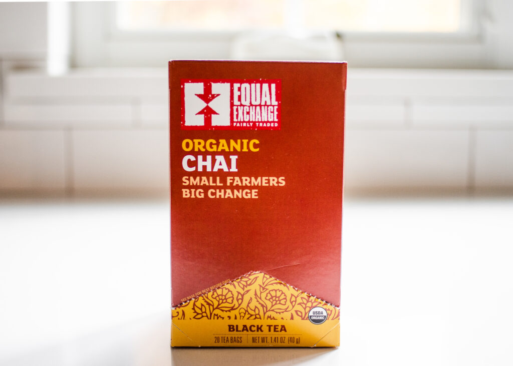Equal Exchange organic chai tea on a white countertop.