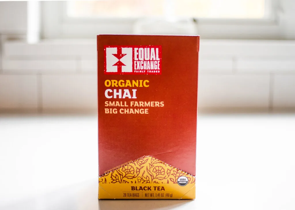 Equal Exchange organic chai tea on a white countertop.