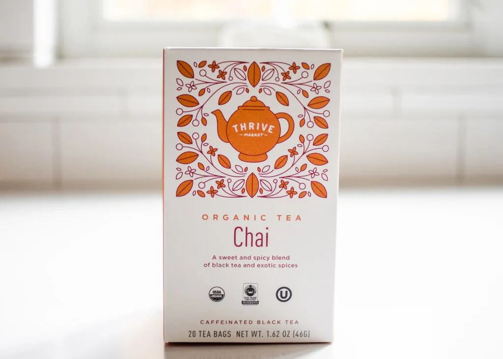 Thrive Market Masala Chai tea bags on a white countertop.