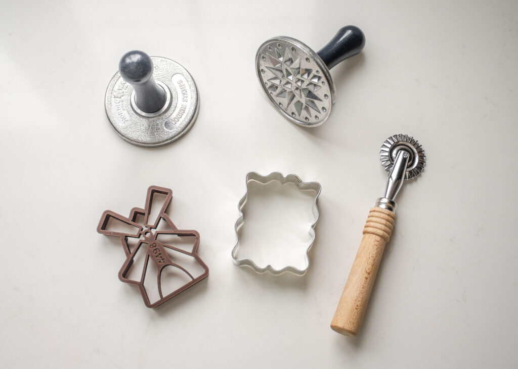 Different cookie cutters, cookie stamps, etc. for forming the speculoos cookies. 