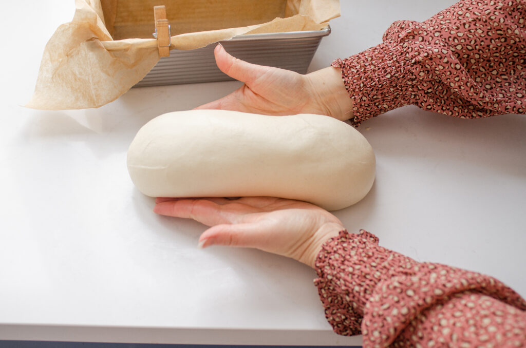 Creating surface tension on the loaf.