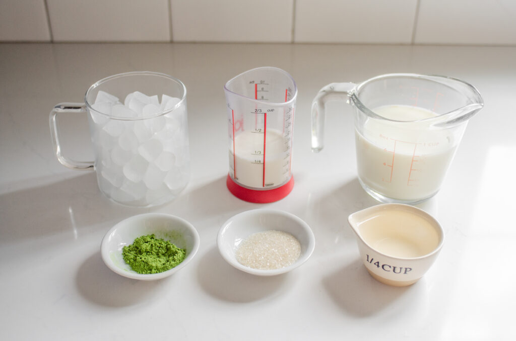 All of the ingredients needed to make an iced matcha latte (Starbucks copycat recipe).