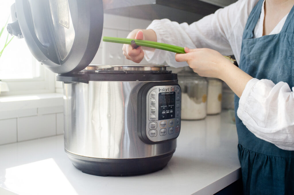 Slicing vegetables into the Instant Pot.