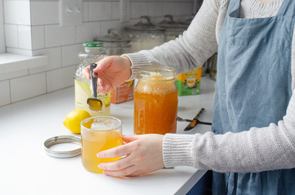 Adding honey to the Starbucks medicine ball tea.