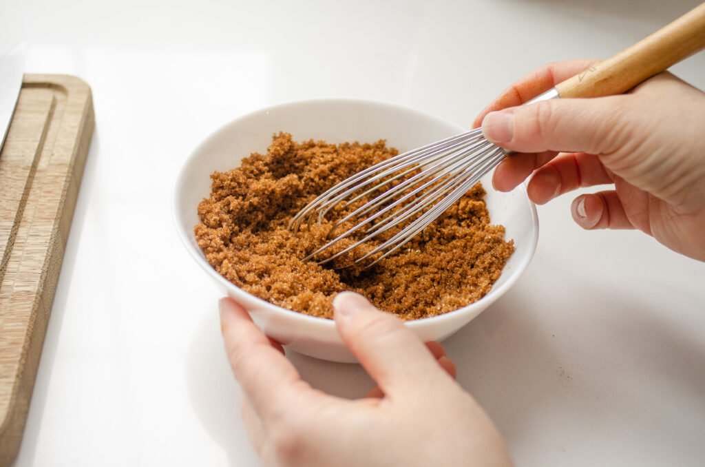 Whisking together the brown sugar and cinnamon for the filling and topping of the sourdough coffee cake.