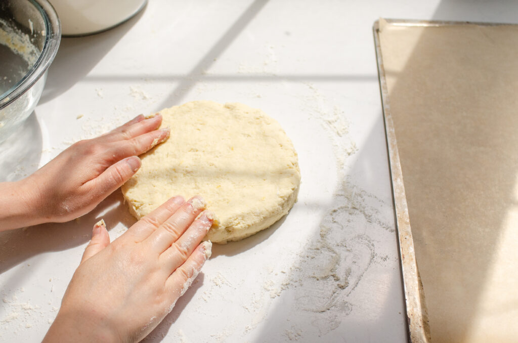 Forming the lemon scone dough into a disc. 