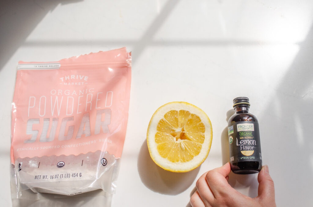 All of the ingredients needed to make a lemon glaze to go on top of the scones.