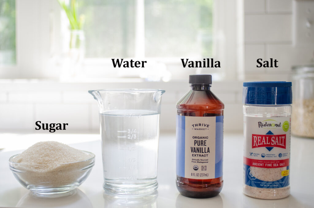 All of the basic ingredients needed to make vanilla syrup for coffee at home.