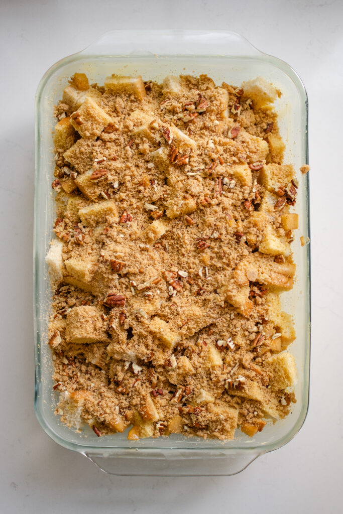 The pan of apple French toast casserole with the streusel on top.