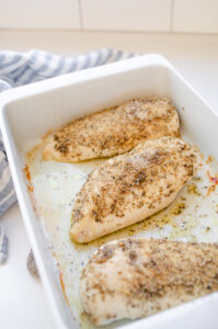 A pan of Thanksgiving flavored chicken breasts.