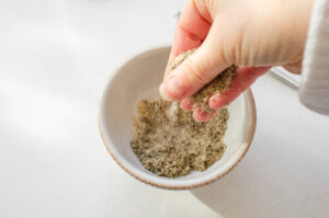 Mixing together the spices in a small bowl. 