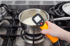 Heating milk over the stove to froth for a latte.