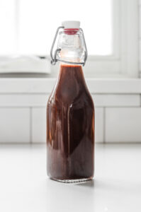 Chocolate syrup for coffee in a flip top bottle.