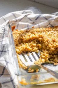 A pan of baked oatmeal with some taken out.