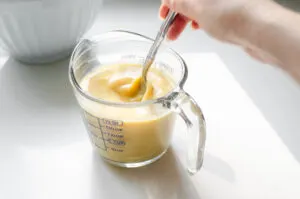 Whisking together the wet ingredients with a fork.