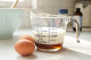 Measuring out the wet ingredients for baked oatmeal.