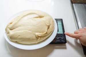 Weighing all of the dough.