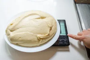 Weighing all of the dough.