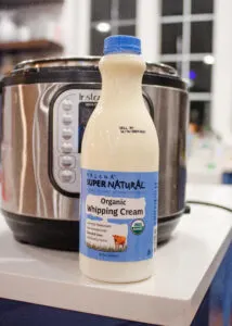 Low temp Pasteurized cream on a counter in front of an Instant Pot.