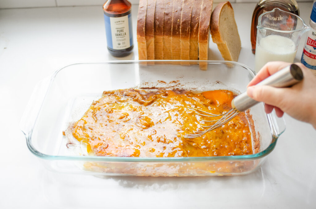 Whisking the pumpkin pie spice into the eggs and pumpkin puree.