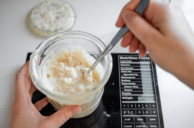 Feeding a sourdough starter in a Weck jar.