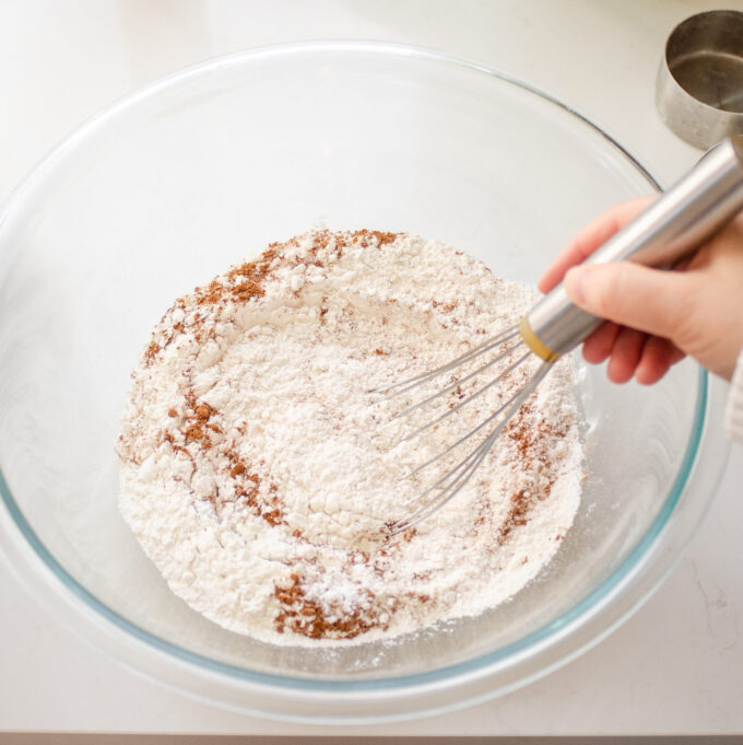Whisking the dry ingredients in a large bowl.