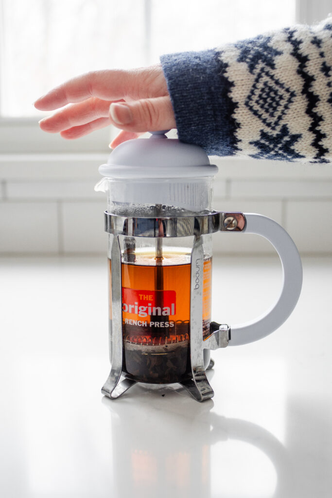 Plunging down a French press.