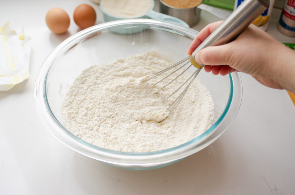 Whisking together the dry ingredients in a medium bowl.