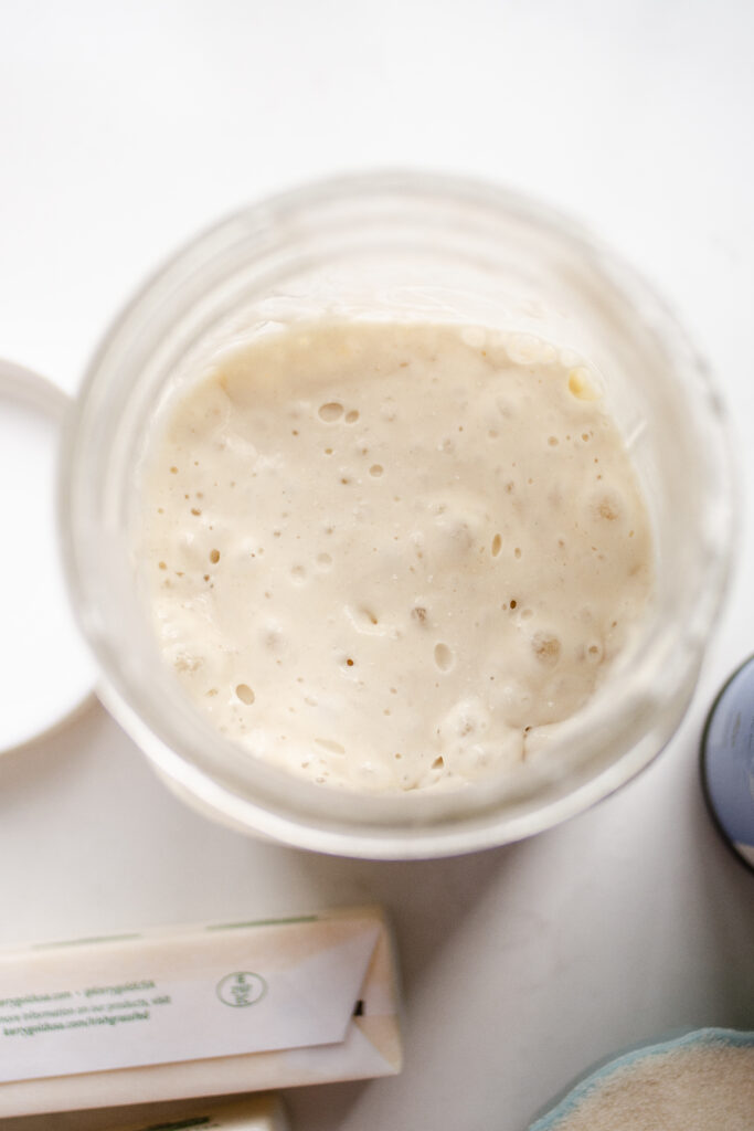 A top down view of a jar of sourdough discard.