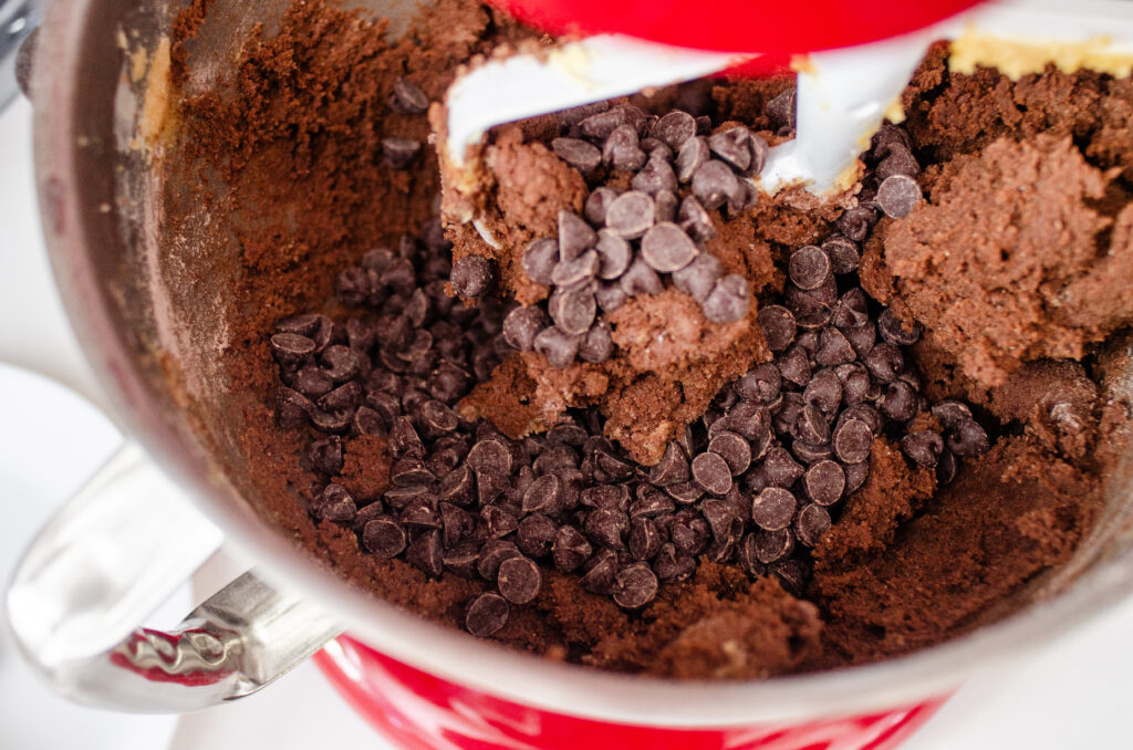 Adding the chocolate chips to the dough.