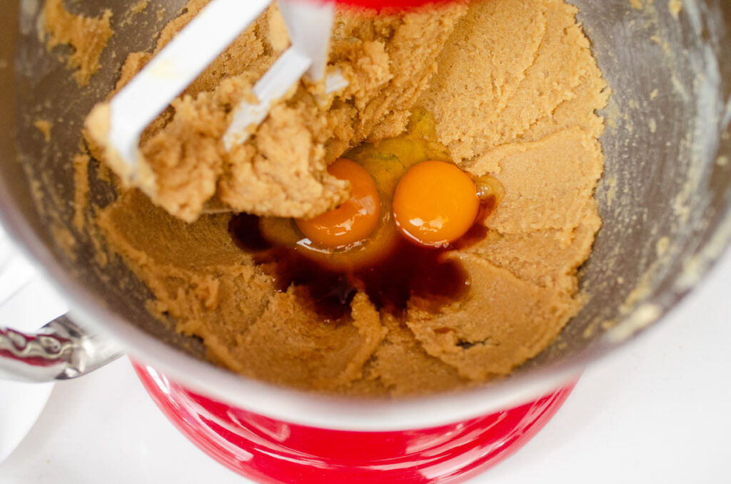 Adding the eggs and vanilla.