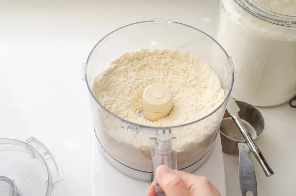 After cutting the butter into the dry ingredients.