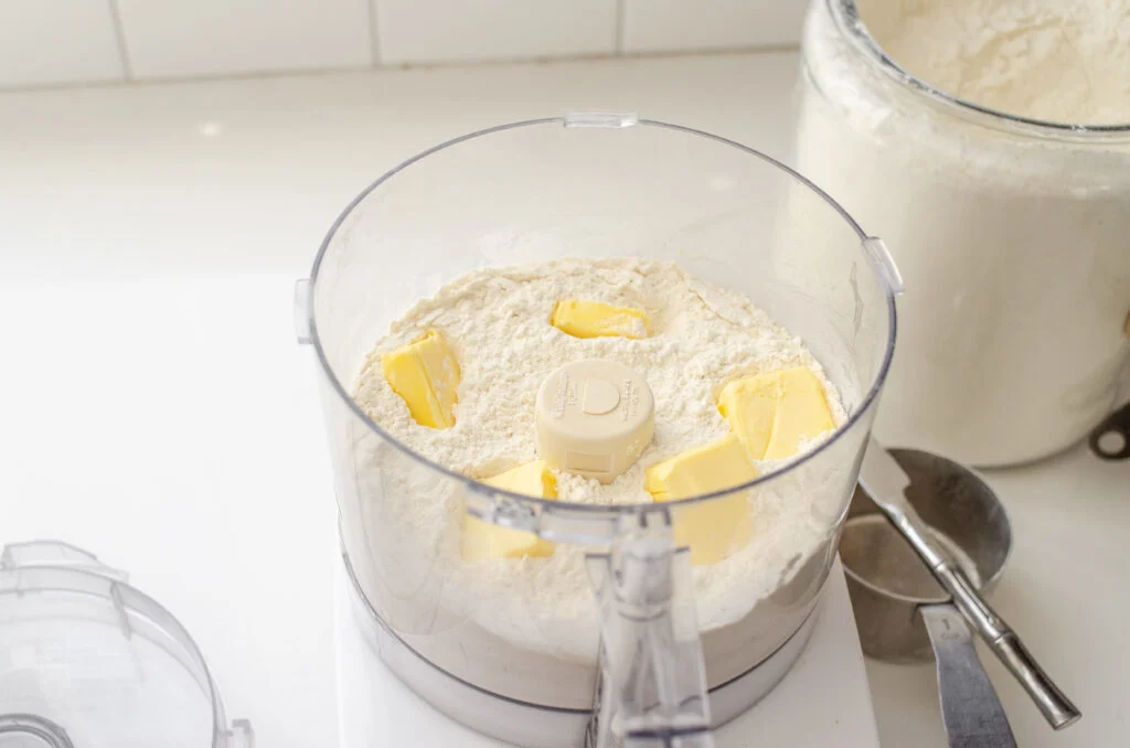Butter pieces scattered in the dry ingredients.
