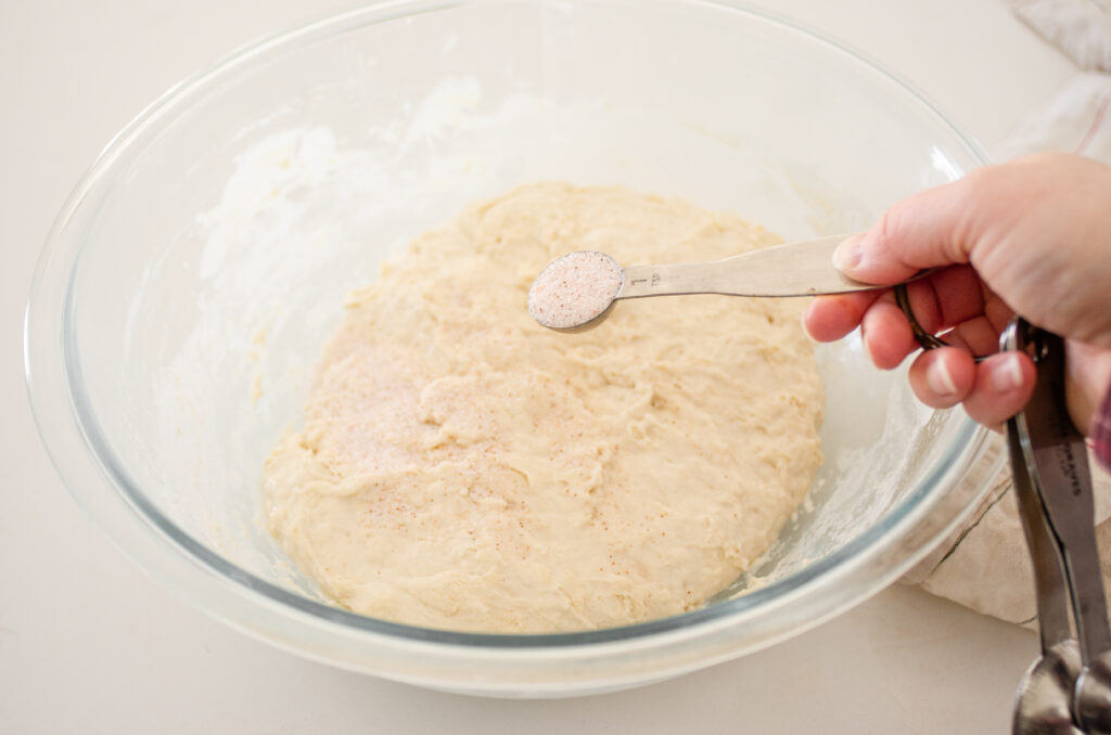 Adding the salt to the dough.