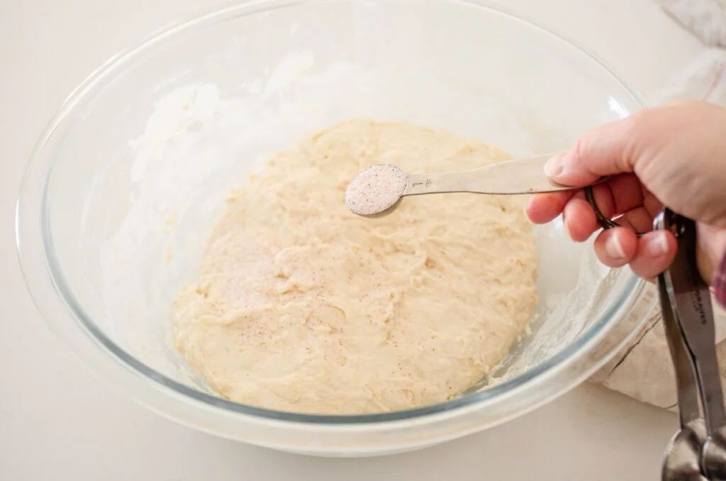 Adding the salt to the dough.