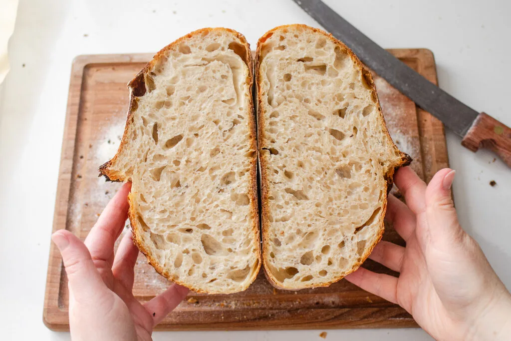 A crumb shot of a sourdough batard that's been baked in a Dutch oven.