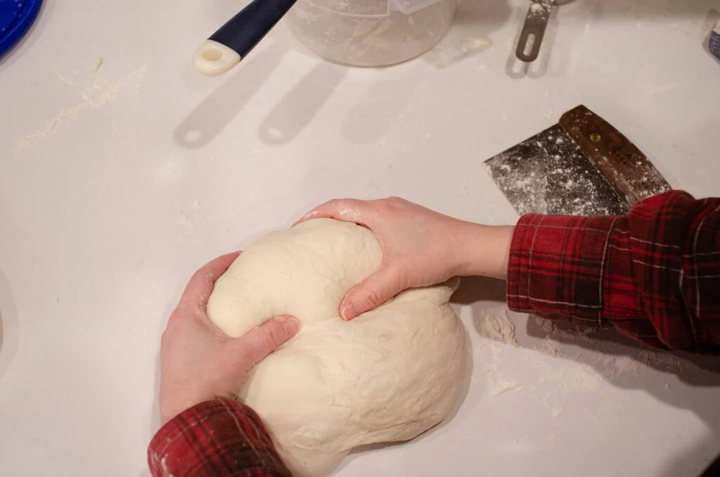 Rolling the dough up like a traditional loaf of bread.