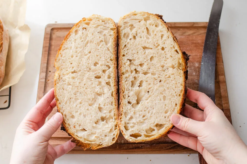 A crumb shot of a 60% hydration sourdough boule bread baked in a Dutch oven.