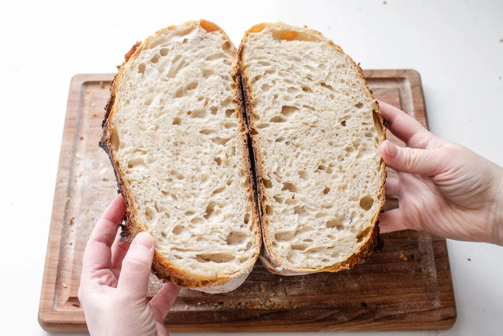 A round loaf of sourdough bread made with 100 grams of whole wheat flour.