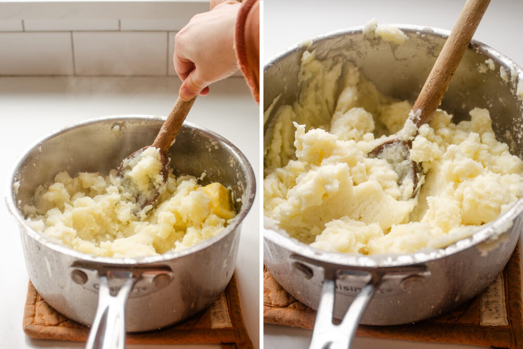 Mashing potatoes with a wooden spoon.