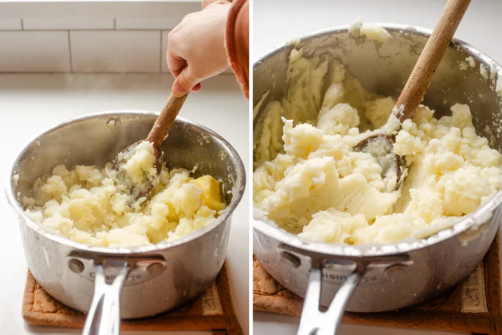 Mashing potatoes with a wooden spoon.